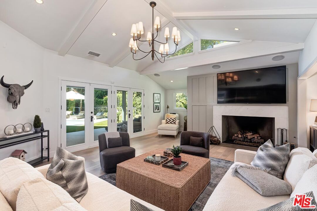 Chandelier, Fireplace, Interior, Living room, Recessed Lighting, Wood Texture Flooring