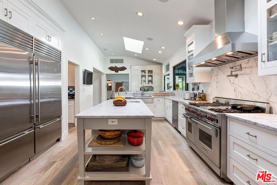 Interior, Kitchen, Marble Walls, Recessed Lighting, Stainless Steel Appliances, Wood Texture Flooring