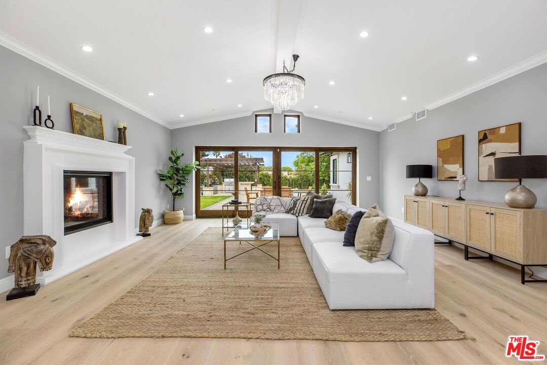 Chandelier, Fireplace, Interior, Living room, Recessed Lighting, Wood Texture Flooring