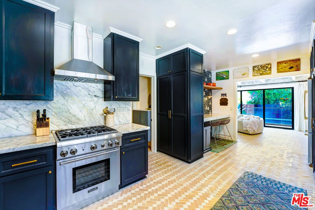 Interior, Kitchen, Marble Walls, Recessed Lighting, Stainless Steel Appliances