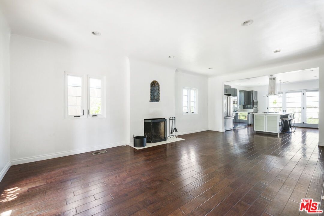 Empty room, Fireplace, Interior, Kitchen, Pendant Lights, Recessed Lighting, Wood Texture Flooring