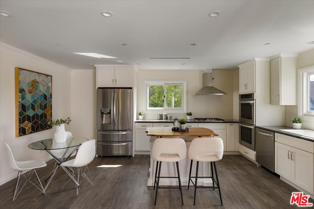 Dining room, Interior, Kitchen, Recessed Lighting, Stainless Steel Appliances, Wood Texture Flooring