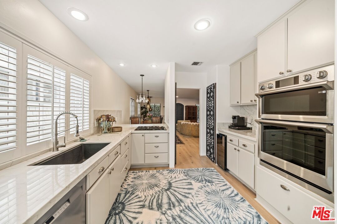 Chandelier, Interior, Kitchen, Recessed Lighting, Stainless Steel Appliances, Wood Texture Flooring