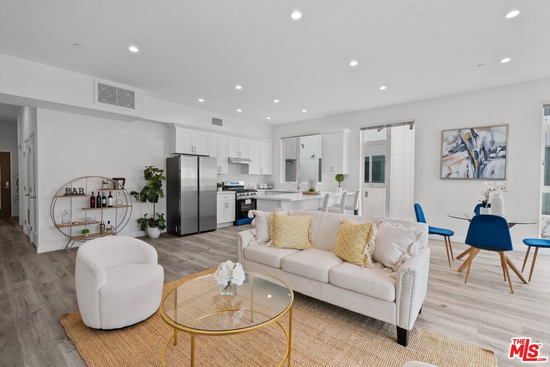 Dining room, Interior, Kitchen, Living room, Recessed Lighting, Stainless Steel Appliances, Wood Texture Flooring