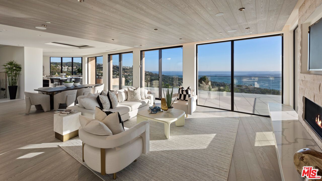 Dining room, Fireplace, Interior, Living room, Recessed Lighting, Water, Wooden Ceilings, Wood Texture Flooring