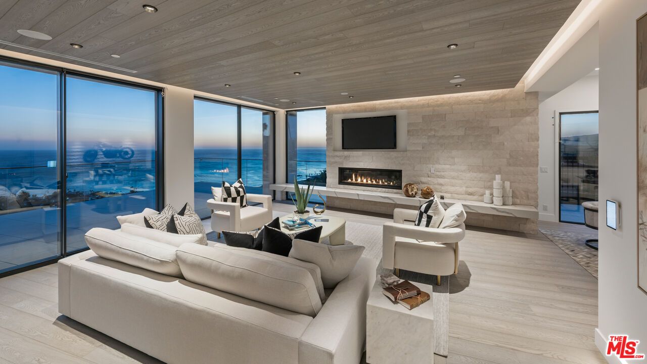 Fireplace, Interior, Living room, Recessed Lighting, Stone Walls, Water, Wooden Ceilings, Wood Texture Flooring