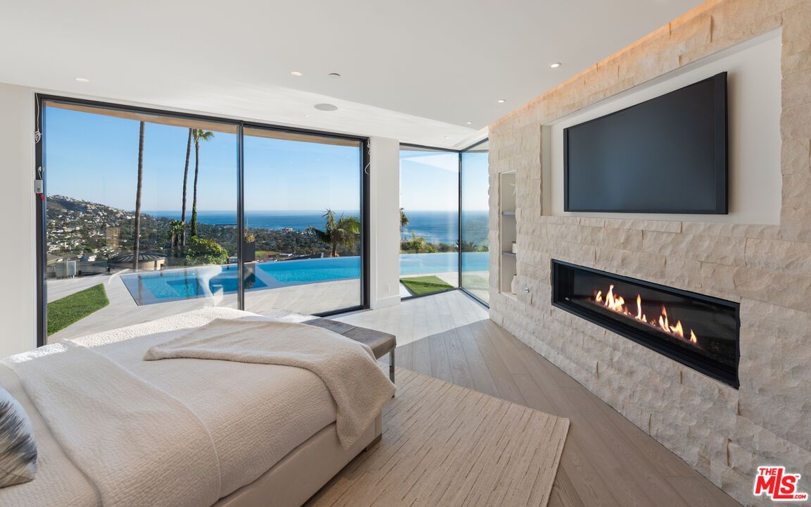 Bedroom, Fireplace, Interior, Recessed Lighting, Water, Wood Texture Flooring