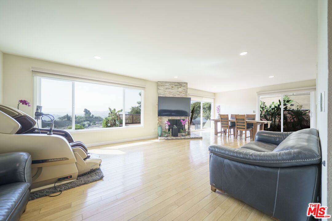 Dining room, Fireplace, Fitness Equipment, Interior, Recessed Lighting, Wood Texture Flooring