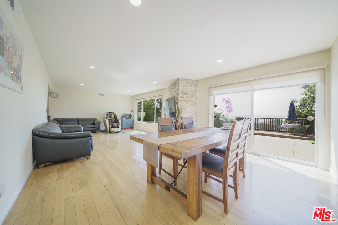 Dining room, Fireplace, Interior, Living room, Recessed Lighting, Wood Texture Flooring