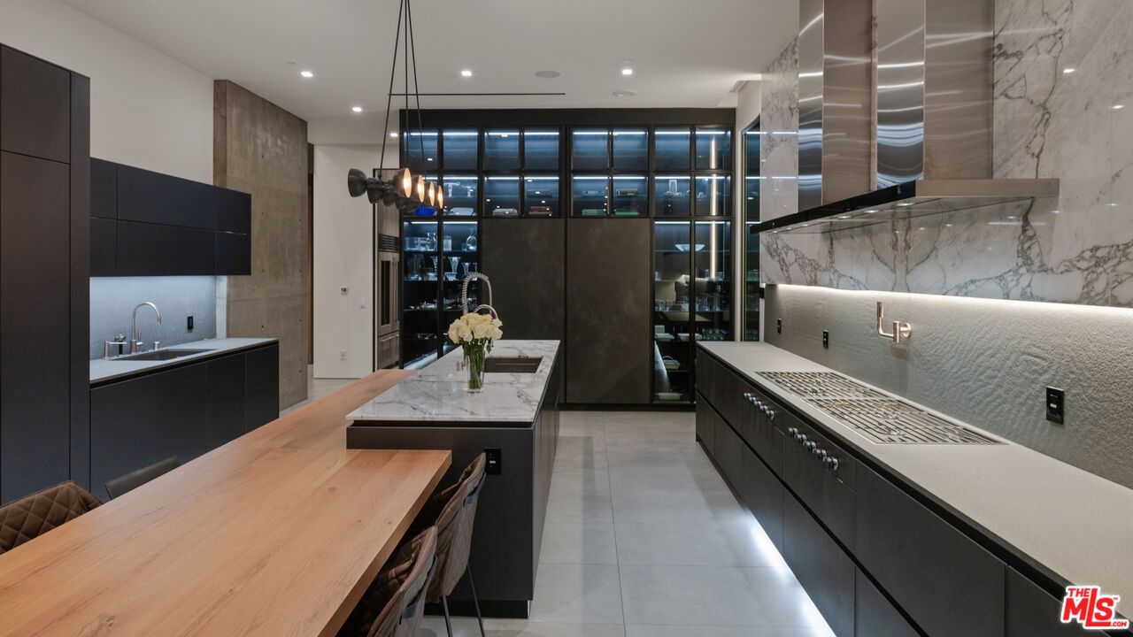 Interior, Kitchen, Marble Walls, Pendant Lights, Recessed Lighting, Stainless Steel Appliances