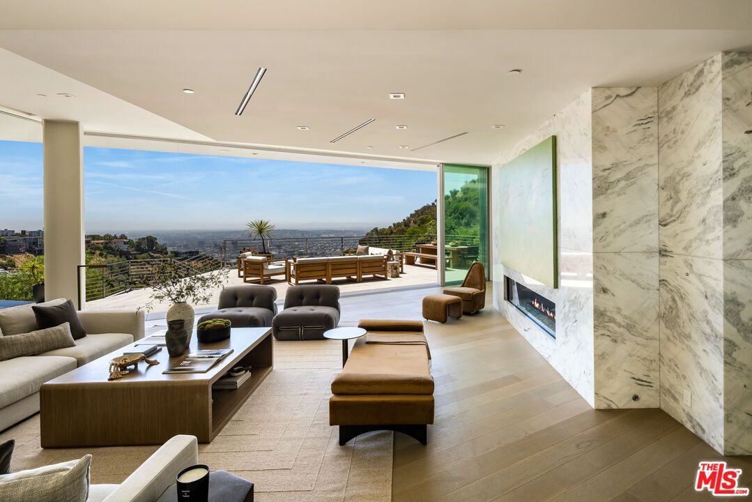 Fireplace, Interior, Living room, Marble Walls, Recessed Lighting, Water, Wood Texture Flooring
