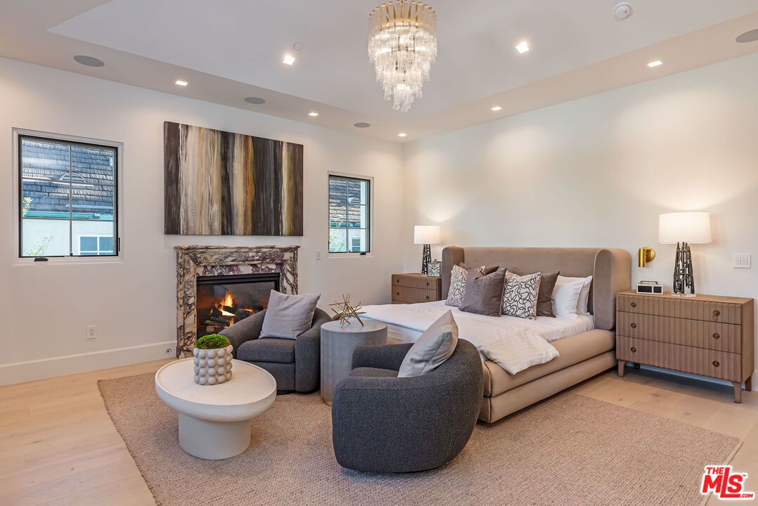Bedroom, Chandelier, Fireplace, Interior, Recessed Lighting, Wood Texture Flooring