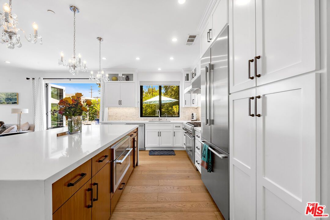 Chandelier, Interior, Kitchen, Pendant Lights, Recessed Lighting, Stainless Steel Appliances, Wood Texture Flooring