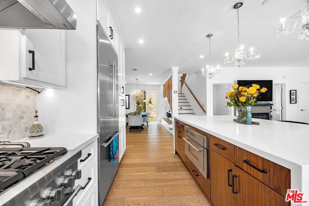 Chandelier, Interior, Kitchen, Pendant Lights, Recessed Lighting, Stainless Steel Appliances, Wood Texture Flooring