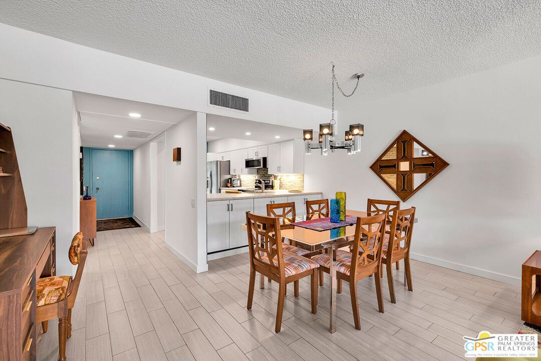 Chandelier, Dining room, Interior, Kitchen, Pendant Lights, Recessed Lighting, Stainless Steel Appliances, Wood Texture Flooring