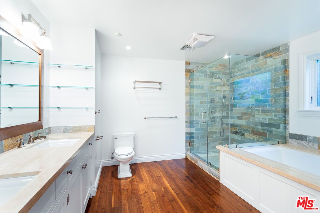 Bathroom, Dual Sink Vanities, Glass Shower, Interior, Recessed Lighting, Wood Texture Flooring