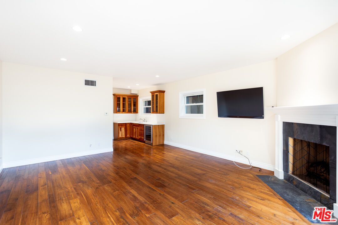 Empty room, Fireplace, Interior, Kitchen, Recessed Lighting, Wood Texture Flooring