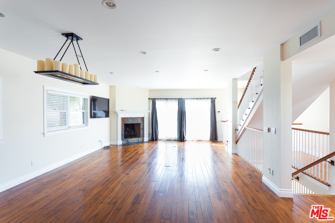 Empty room, Fireplace, Interior, Pendant Lights, Recessed Lighting, Wood Texture Flooring