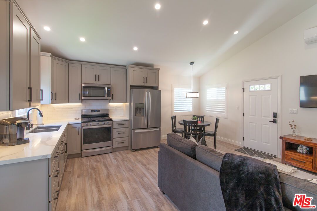 Dining room, Interior, Kitchen, Pendant Lights, Recessed Lighting, Stainless Steel Appliances, Wood Texture Flooring