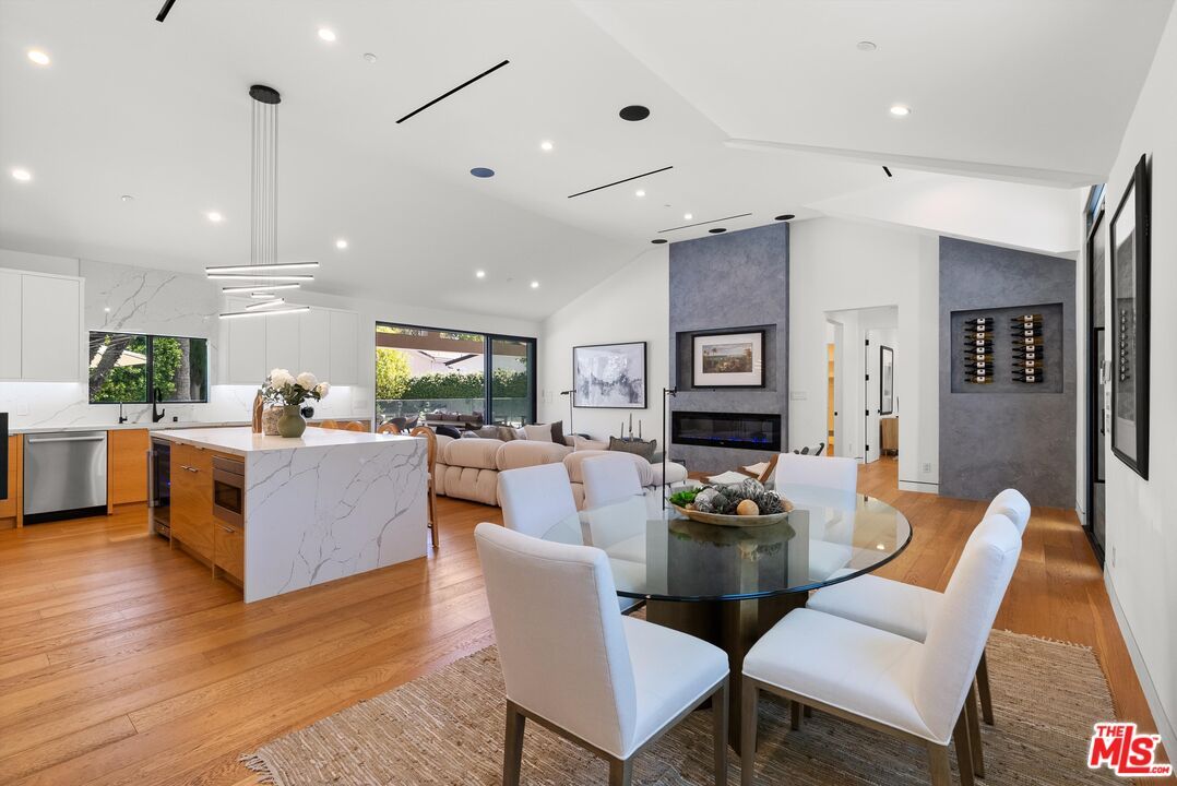 Dining room, Fireplace, Interior, Kitchen, Living room, Marble Walls, Pendant Lights, Recessed Lighting, Wood Texture Flooring