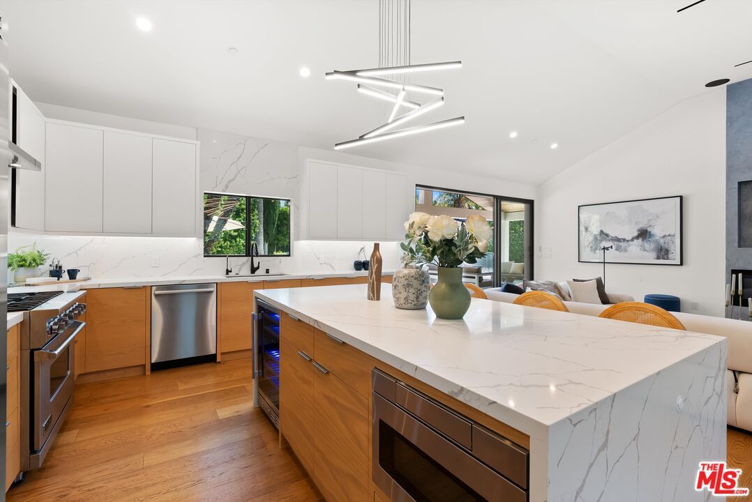 Interior, Kitchen, Marble Walls, Pendant Lights, Recessed Lighting, Stainless Steel Appliances, Wood Texture Flooring