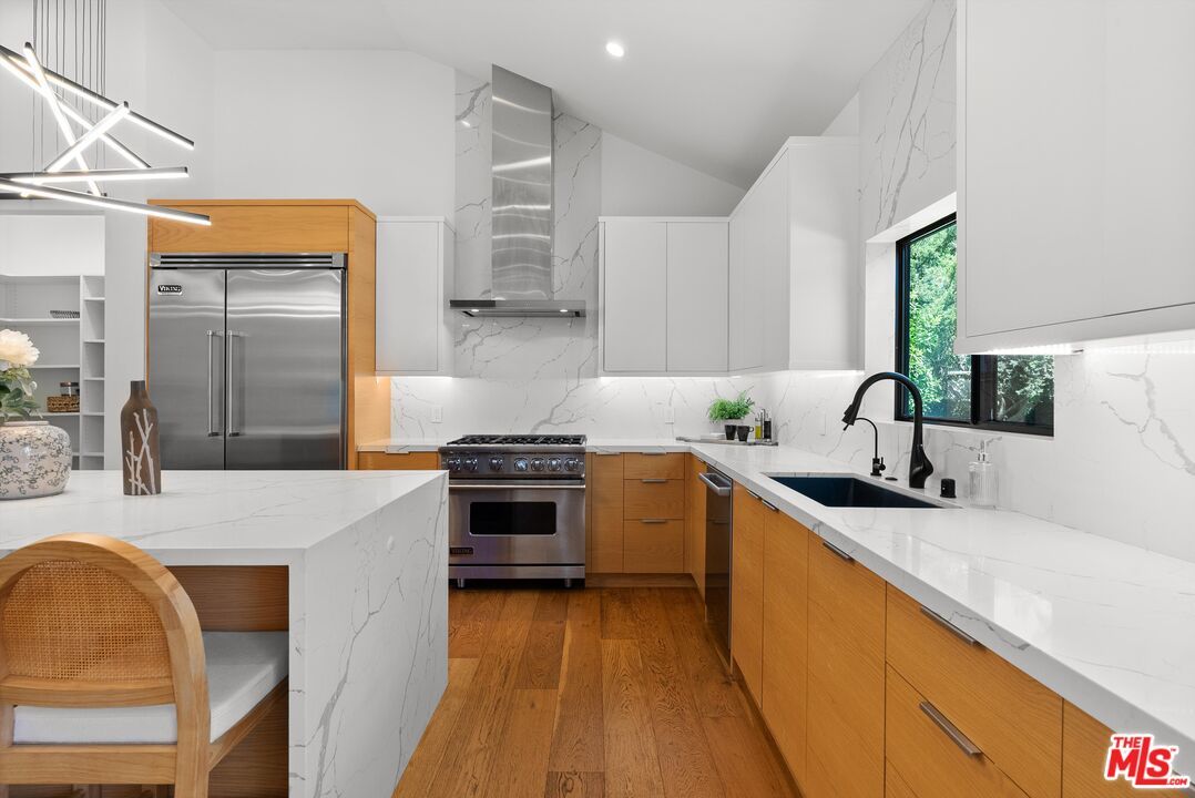 Interior, Kitchen, Marble Walls, Recessed Lighting, Stainless Steel Appliances, Wood Texture Flooring