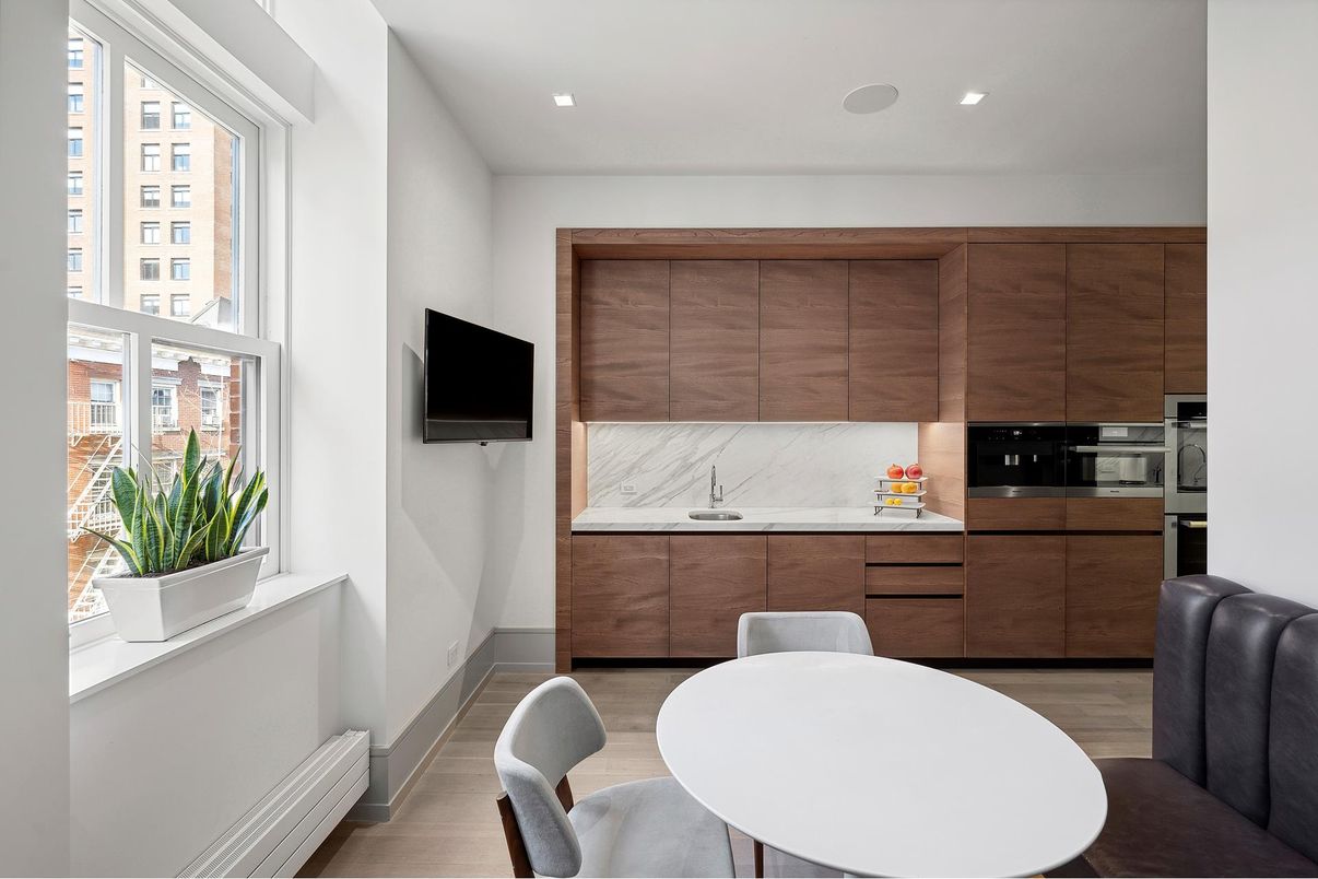 Interior, Kitchen, Marble Walls, Recessed Lighting, Stainless Steel Appliances, Wood Texture Flooring