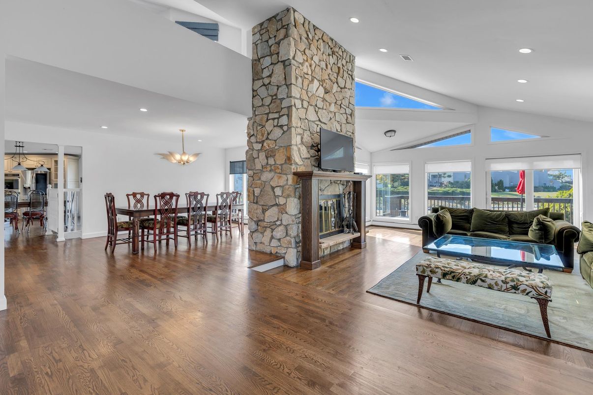 Dining room, Fireplace, Interior, Living room, Pendant Lights, Recessed Lighting, Stone Walls, Wood Texture Flooring
