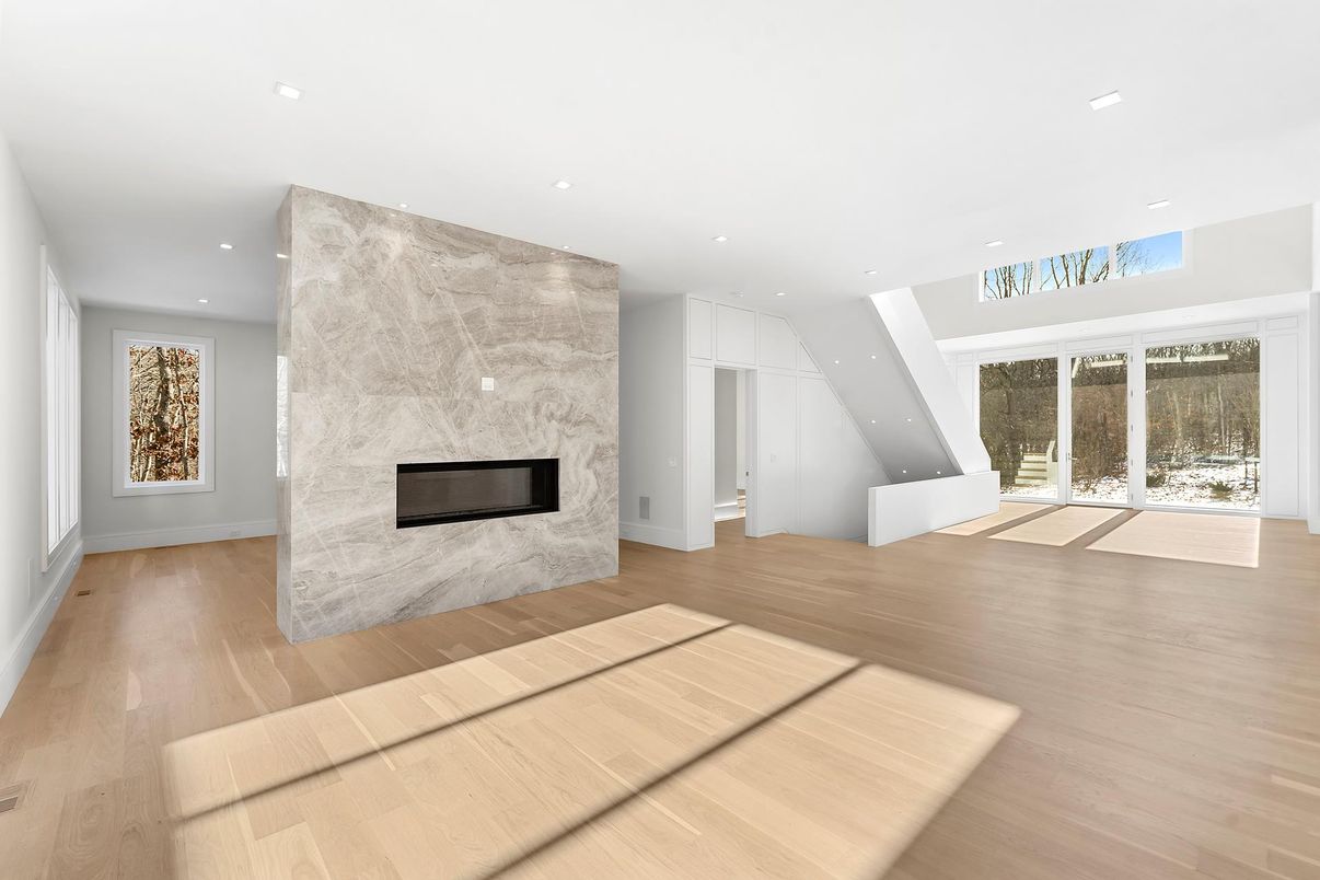 Fireplace, Interior, Marble Walls, Recessed Lighting, Wood Texture Flooring