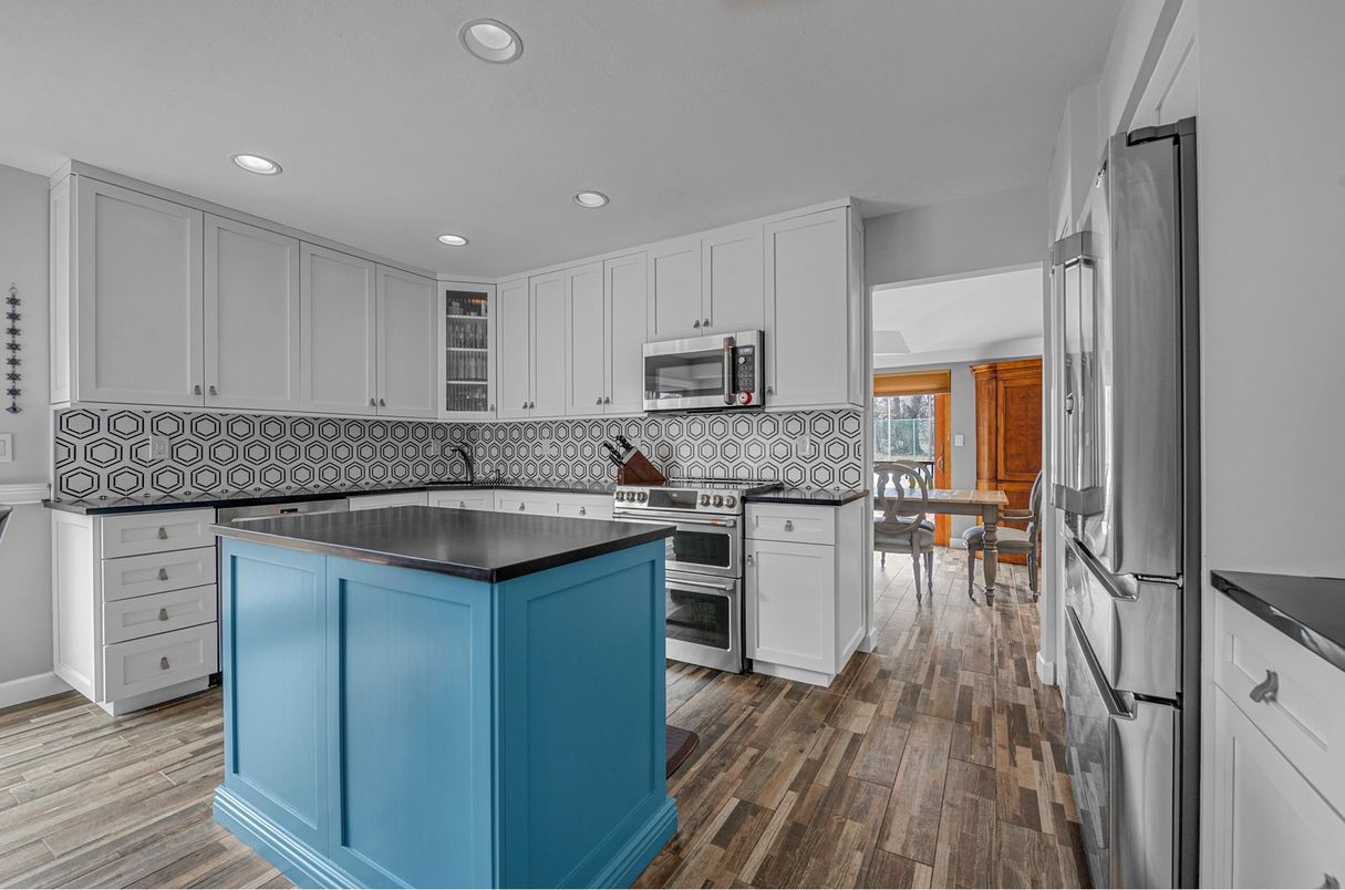 Dining room, Interior, Kitchen, Recessed Lighting, Stainless Steel Appliances, Wood Texture Flooring