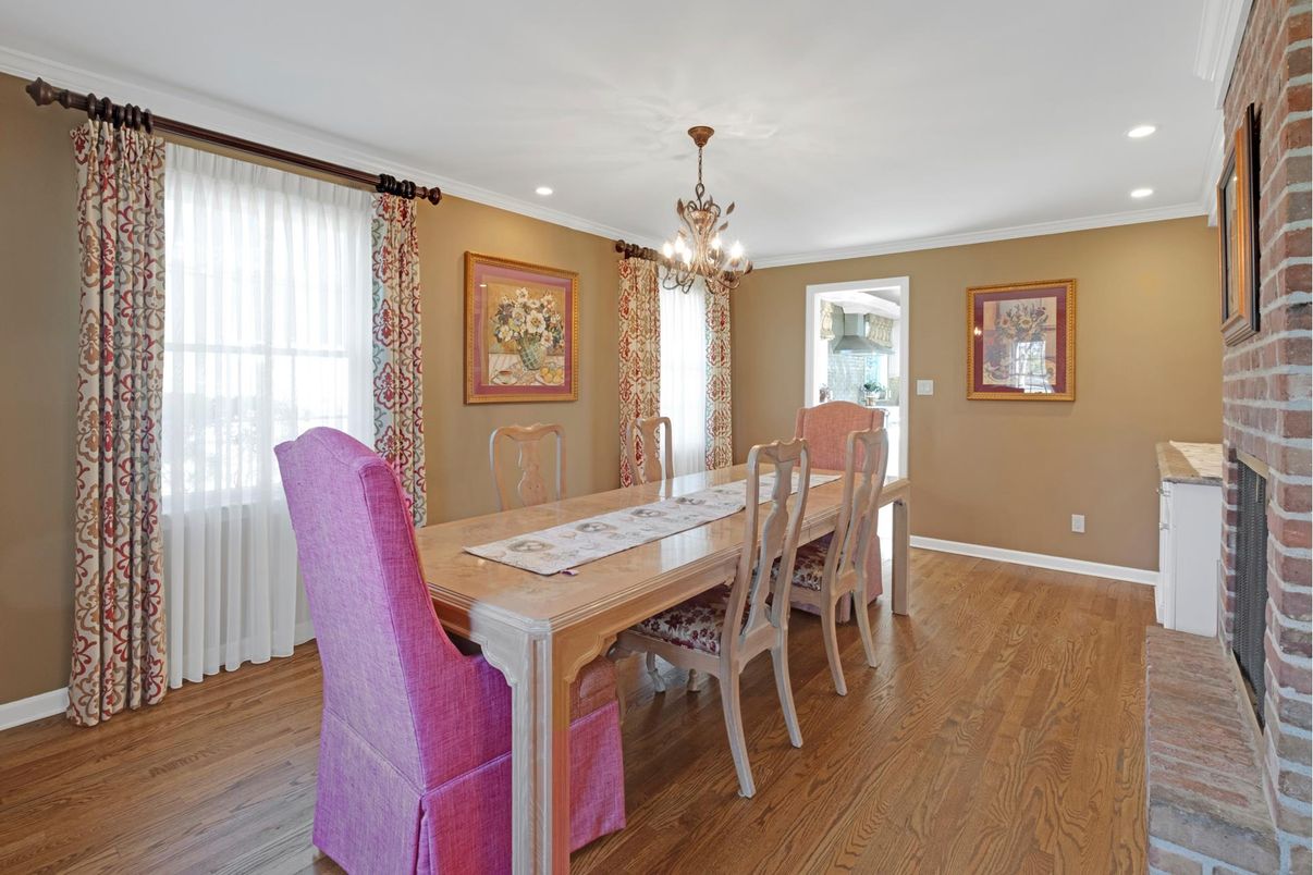 Chandelier, Dining room, Fireplace, Interior, Recessed Lighting, Stone Walls, Wood Texture Flooring