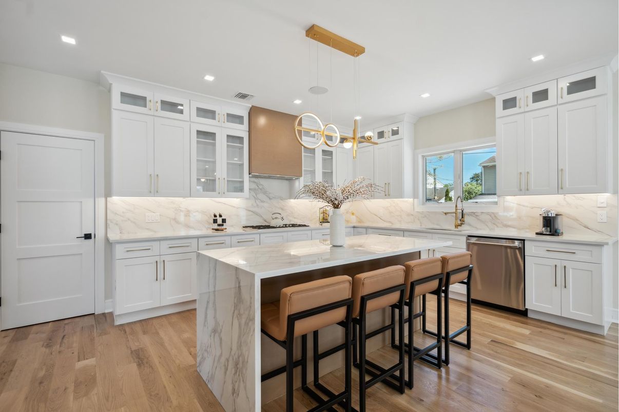Interior, Kitchen, Marble Walls, Pendant Lights, Recessed Lighting, Stainless Steel Appliances, Wood Texture Flooring