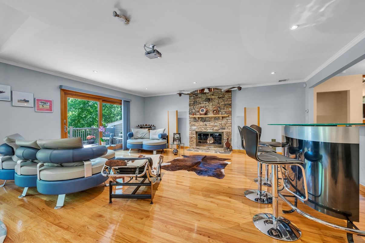 Fireplace, Interior, Living room, Piano, Recessed Lighting, Stone Walls, Wood Texture Flooring