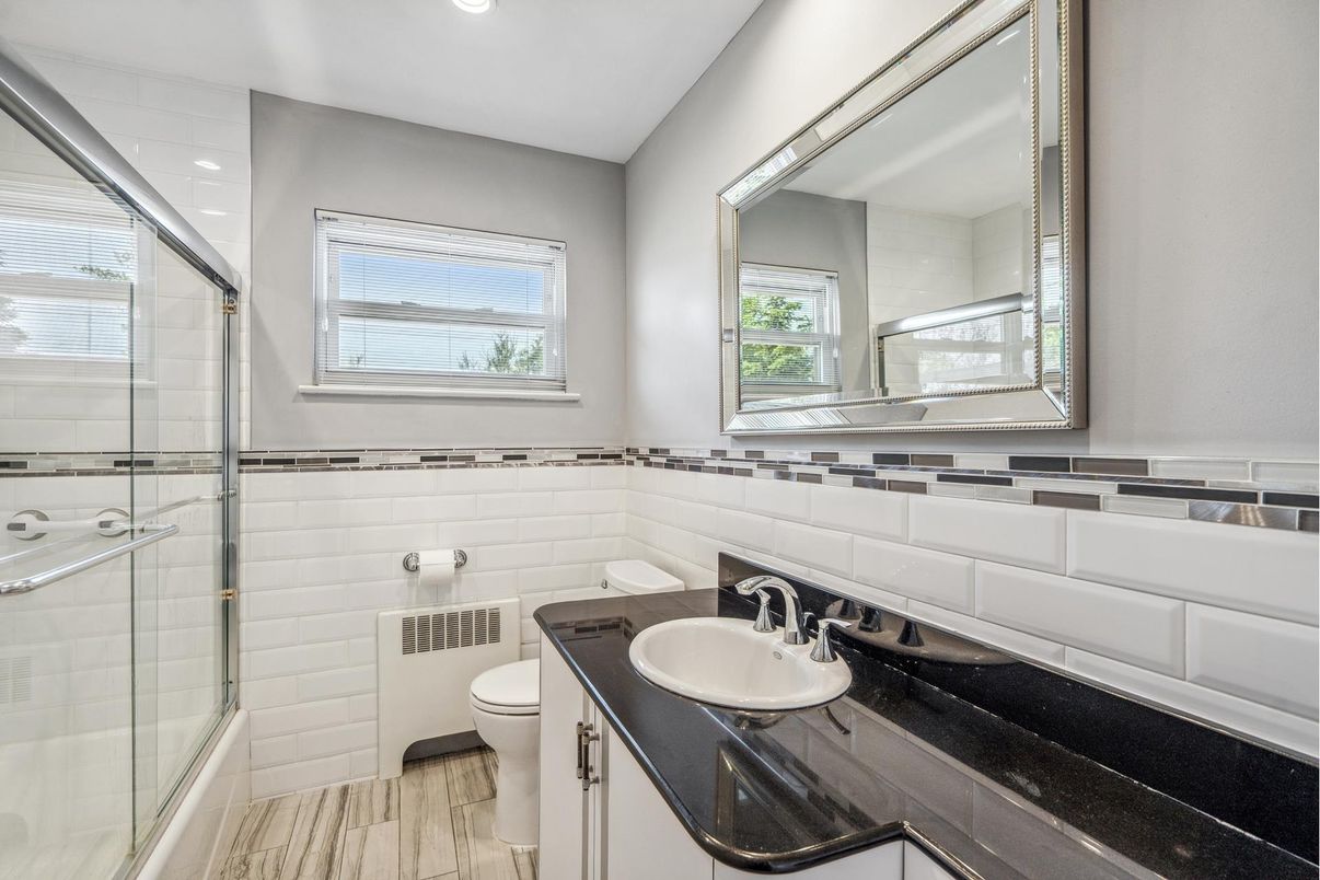 Bathroom, Dual Sink Vanities, Glass Shower, Interior, Recessed Lighting, Wood Texture Flooring