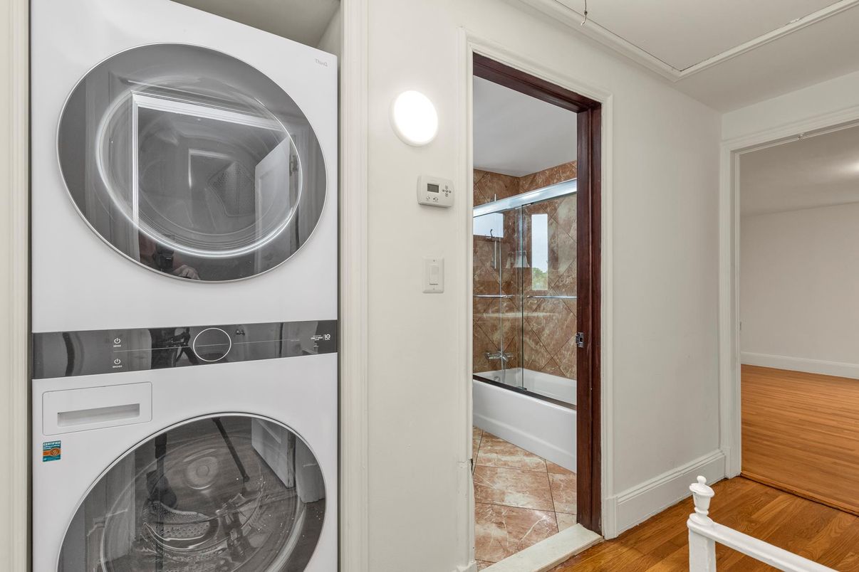 Bathroom, Glass Shower, Interior, Utility Closets, Washer, Wood Texture Flooring