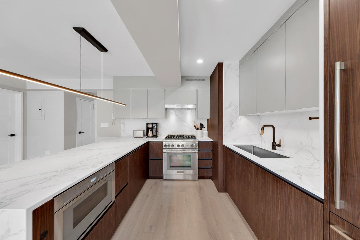 Interior, Kitchen, Marble Walls, Pendant Lights, Recessed Lighting, Stainless Steel Appliances, Wood Texture Flooring