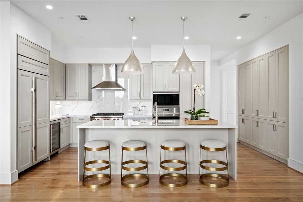 Interior, Kitchen, Marble Walls, Pendant Lights, Recessed Lighting, Stainless Steel Appliances, Wood Texture Flooring