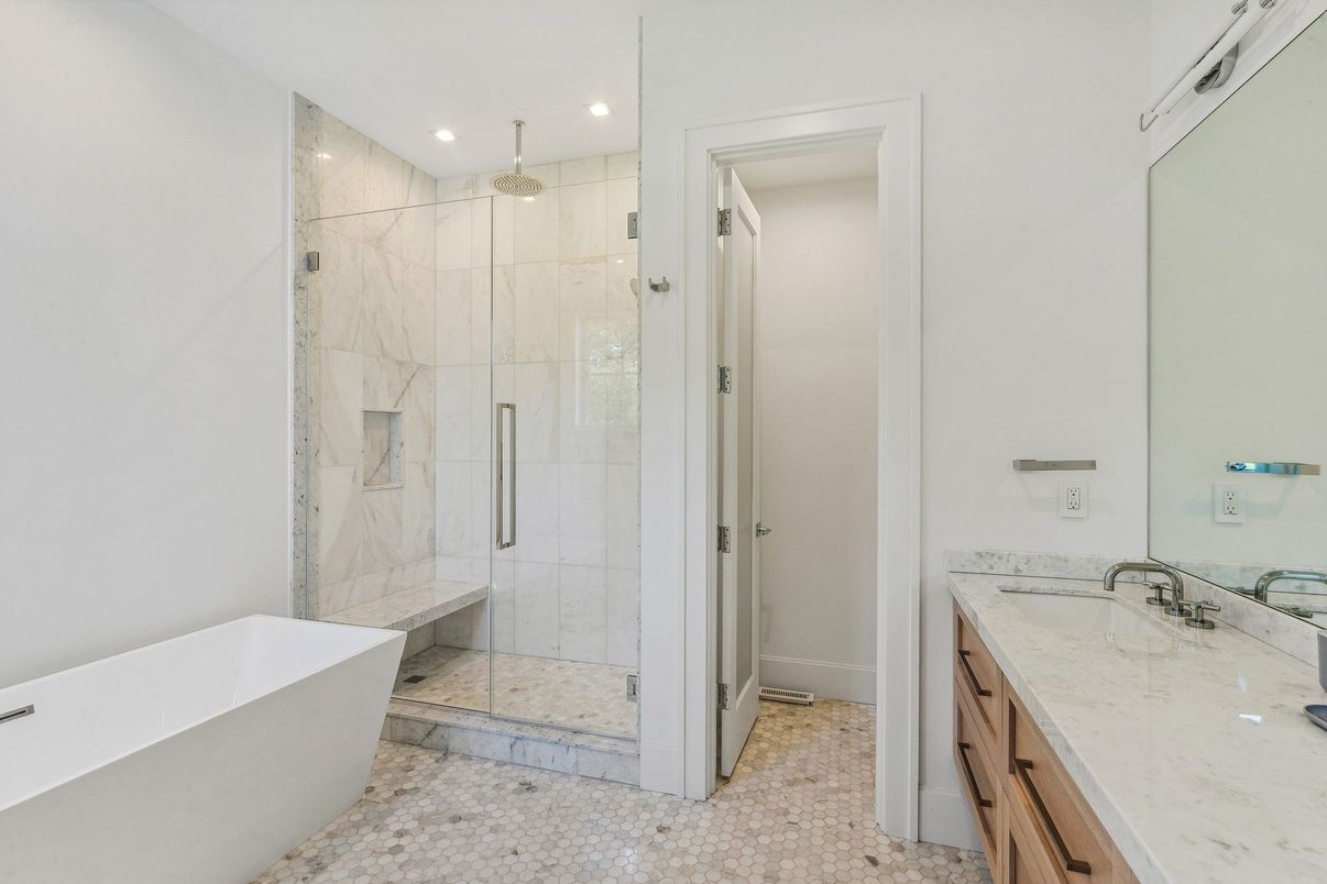 Bathroom, Dual Sink Vanities, Free Standing Baths, Glass Shower, Interior, Marble Walls, Recessed Lighting