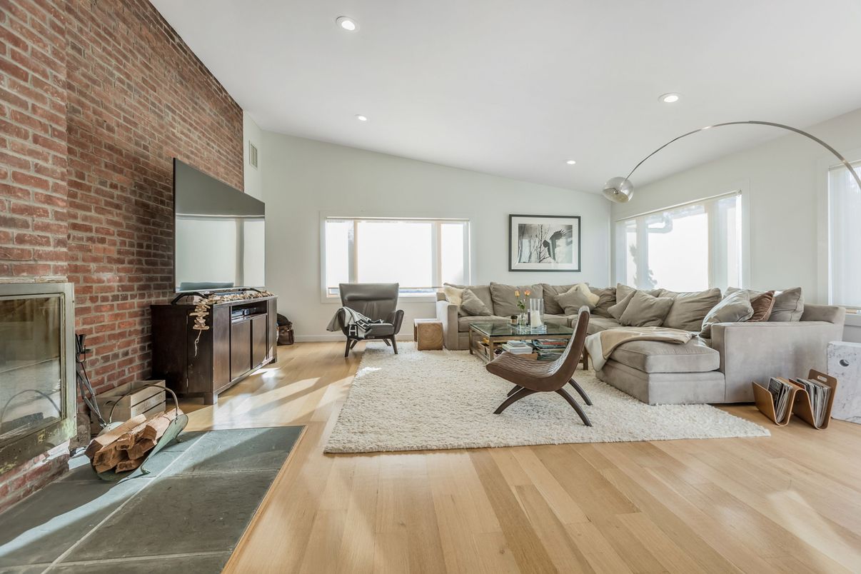 Fireplace, Interior, Living room, Recessed Lighting, Stone Walls, Wood Texture Flooring