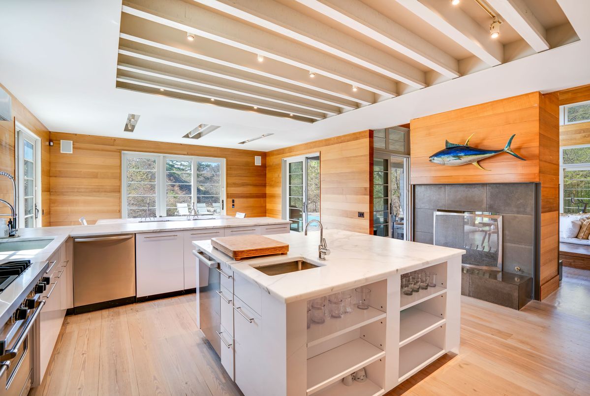 Fireplace, Interior, Kitchen, Recessed Lighting, Stainless Steel Appliances, Wood Texture Flooring, Wooden Walls