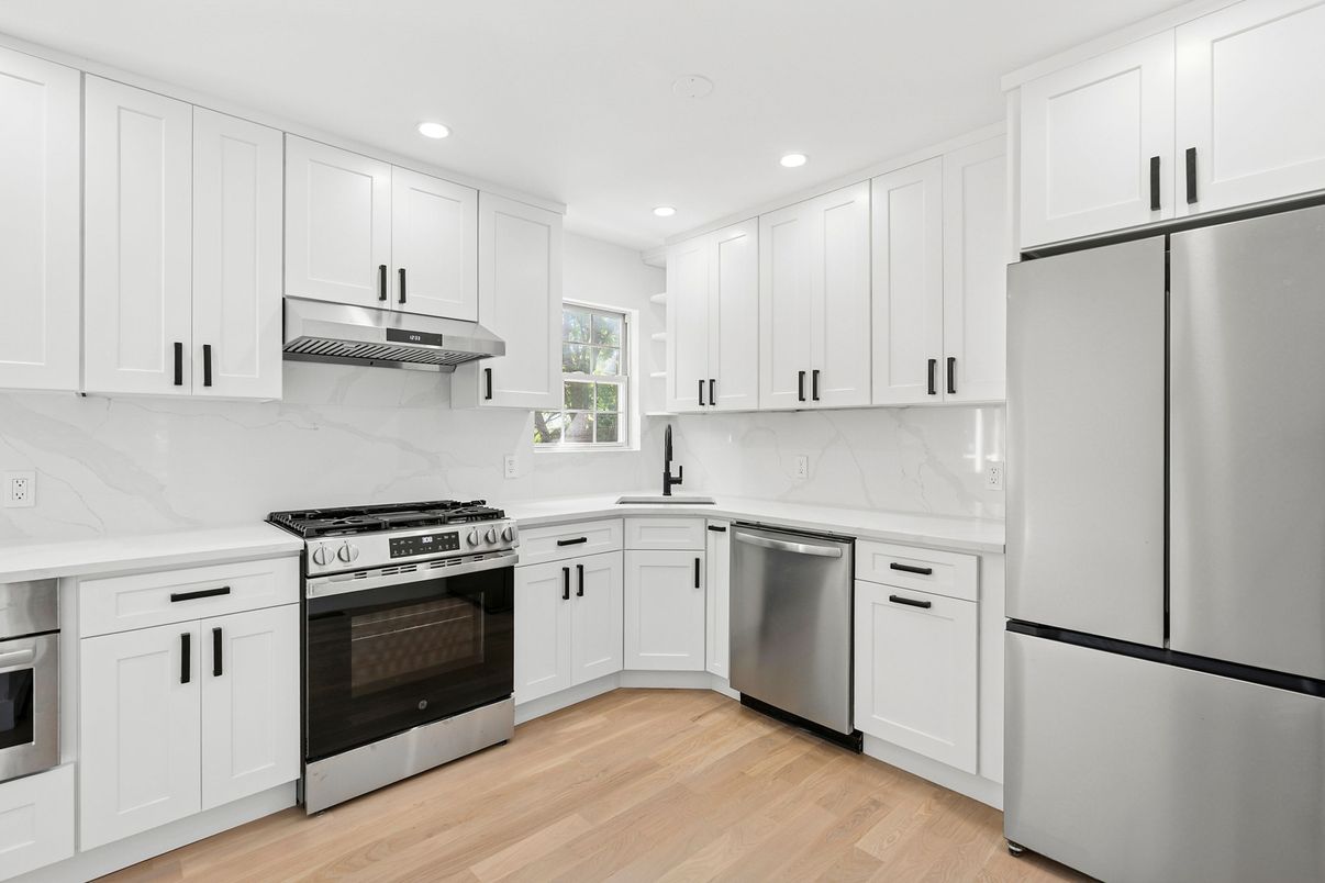 Interior, Kitchen, Marble Walls, Recessed Lighting, Stainless Steel Appliances, Wood Texture Flooring