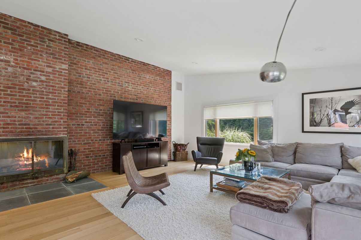 Fireplace, Interior, Living room, Pendant Lights, Recessed Lighting, Stone Walls, Wood Texture Flooring