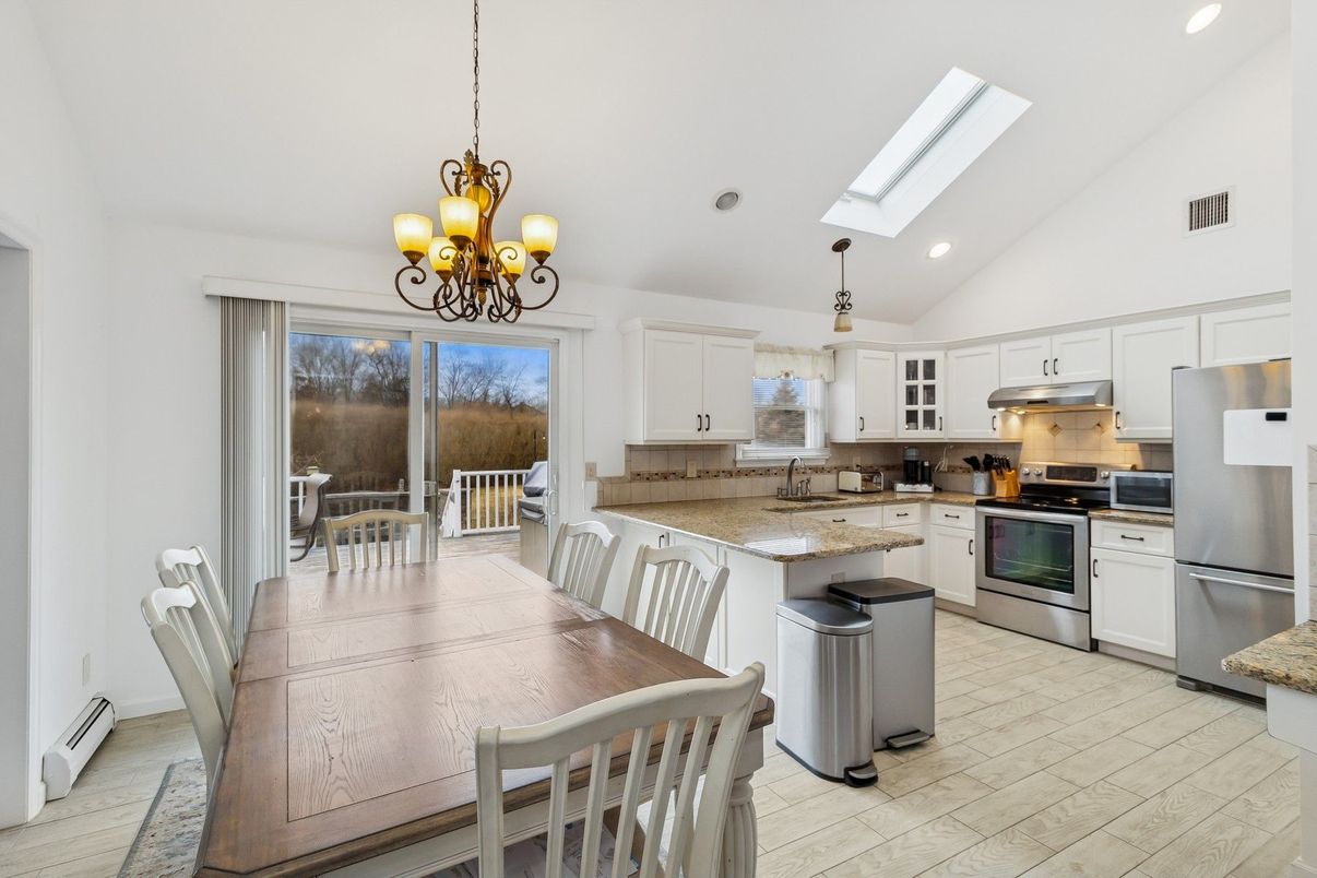 Chandelier, Dining room, Interior, Kitchen, Recessed Lighting, Stainless Steel Appliances, Wood Texture Flooring