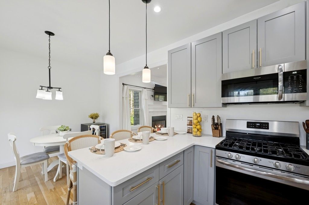 Dining room, Fireplace, Interior, Kitchen, Pendant Lights, Recessed Lighting, Stainless Steel Appliances, Wood Texture Flooring