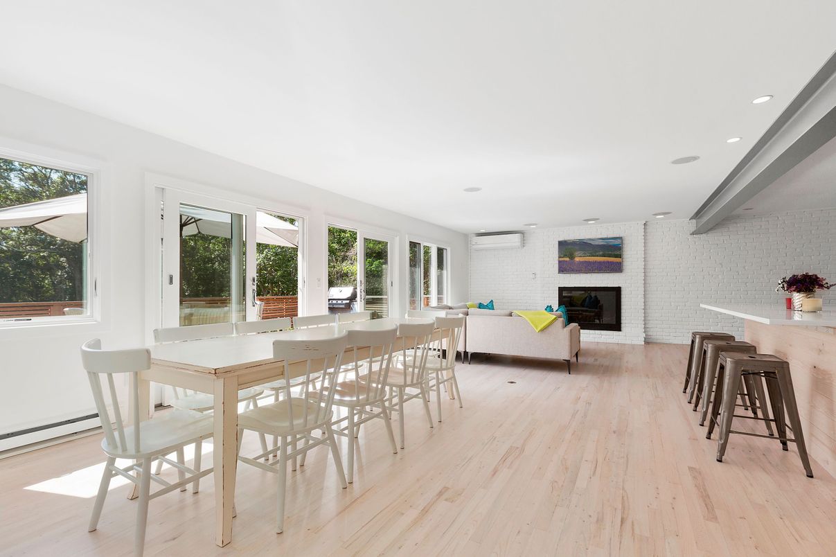 Dining room, Fireplace, Interior, Recessed Lighting, Stone Walls, Wood Texture Flooring