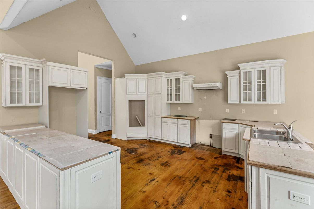 Interior, Kitchen, Recessed Lighting, Tile Countertops, Wood Texture Flooring