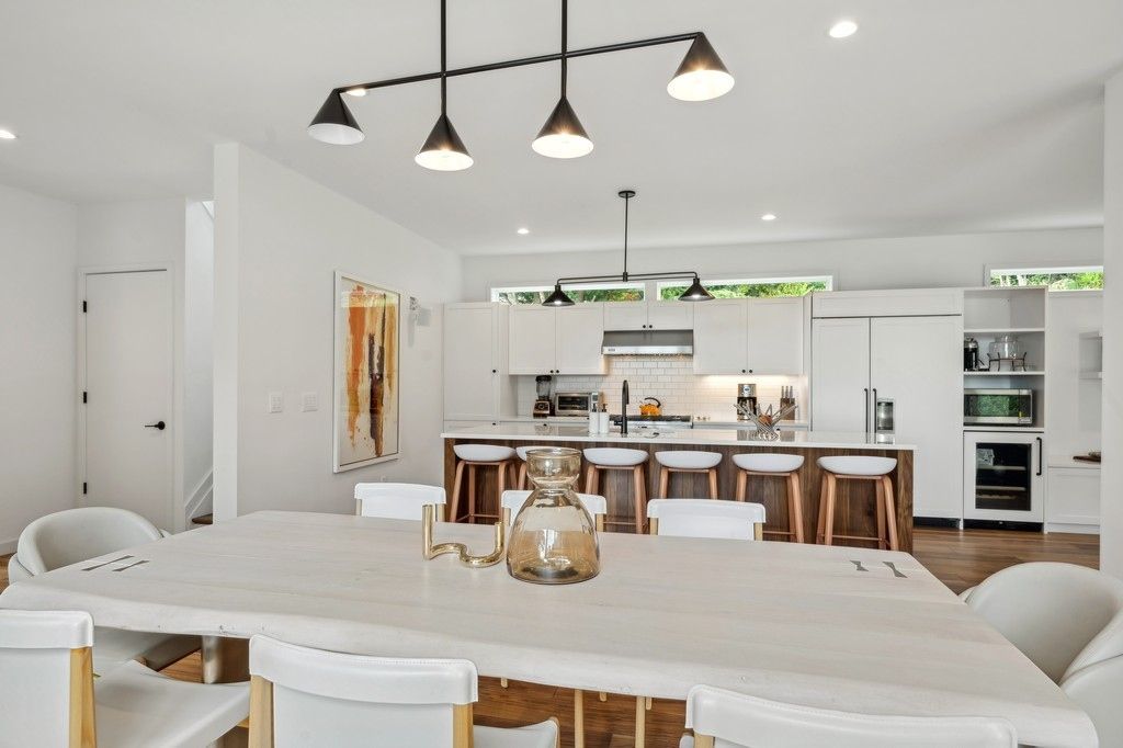 Dining room, Interior, Kitchen, Pendant Lights, Recessed Lighting, Stainless Steel Appliances, Wood Texture Flooring