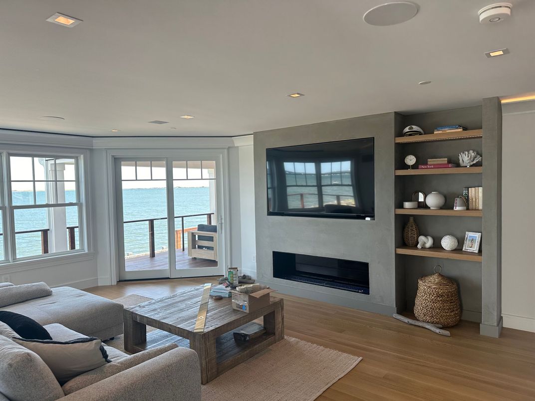 Fireplace, Interior, Living room, Recessed Lighting, Water, Wood Texture Flooring