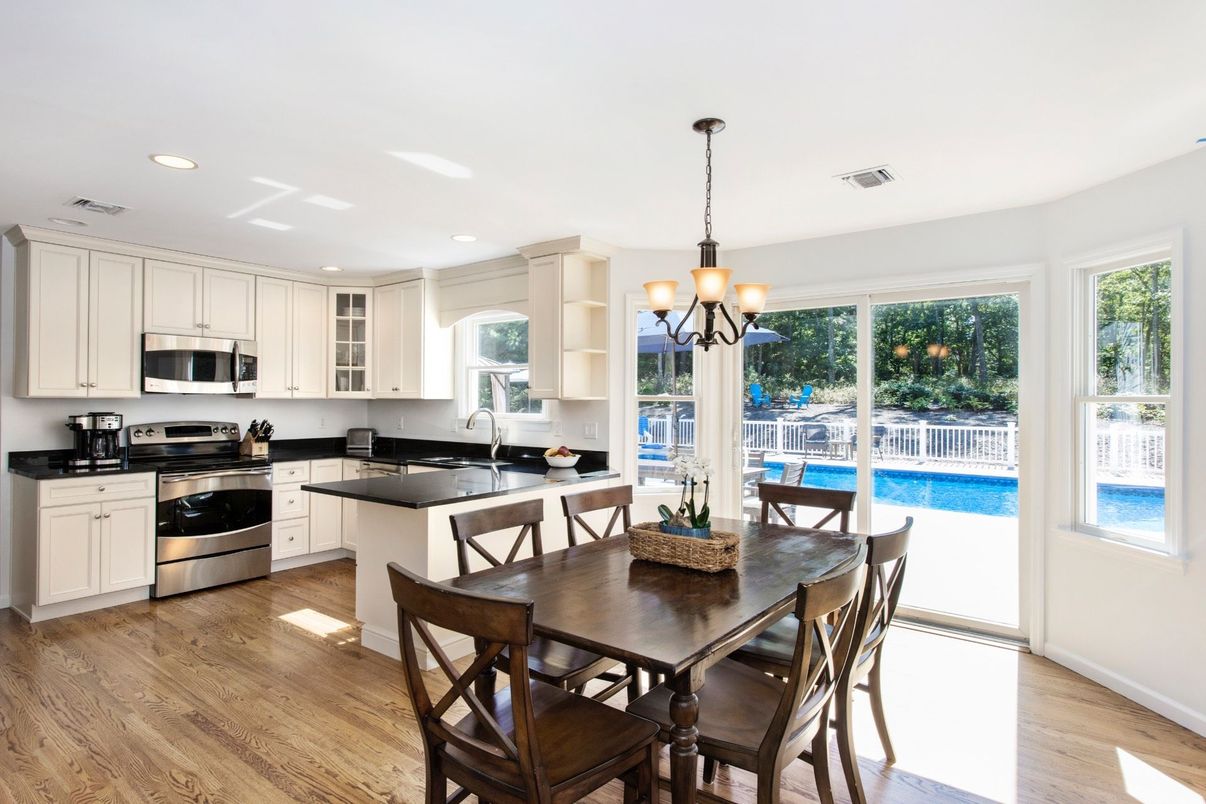 Chandelier, Dining room, Interior, Kitchen, Recessed Lighting, Stainless Steel Appliances, Wood Texture Flooring