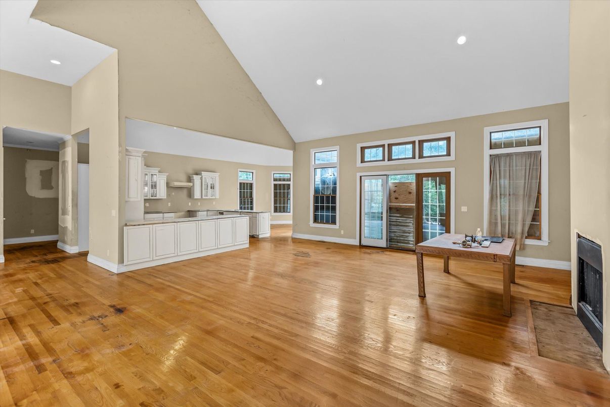 Fireplace, Game Room, Interior, Recessed Lighting, Wood Texture Flooring